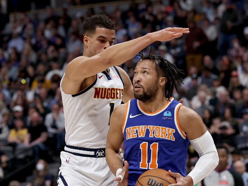 DENVER, COLORADO - MARCH 21: Jalen Brunson #11 of the New York Knicks drives to the basket against Michael Porter Jr. #1 of the Denver Nuggets during the first quarter at Ball Arena on March 21, 2024 in Denver, Colorado. NOTE TO USER: User expressly acknowledges and agrees that, by downloading and or using this photograph, User is consenting to the terms and conditions of the Getty Images License Agreement.  (Photo by Matthew Stockman/Getty Images)