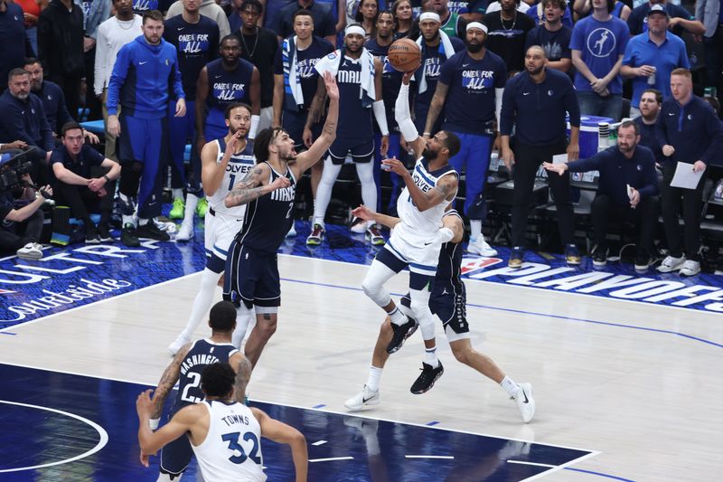 DALLAS, TX - MAY 26: Mike Conley #10 of the Minnesota Timberwolves drives to the basket during the game against the Dallas Mavericks during Game 3 of the Western Conference Finals of the 2024 NBA Playoffs on May 26, 2024 at the American Airlines Center in Dallas, Texas. NOTE TO USER: User expressly acknowledges and agrees that, by downloading and or using this photograph, User is consenting to the terms and conditions of the Getty Images License Agreement. Mandatory Copyright Notice: Copyright 2024 NBAE (Photo by David Sherman/NBAE via Getty Images)