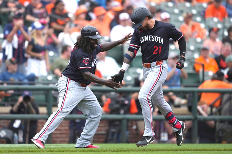 May 15, 2025; Baltimore, Maryland, USA; Minnesota Twins outfielder Dashawn Keirsey (21) greeted by coach Tommy Watkins (4) following his two run home run during the third inning against the Baltimore Orioles at Oriole Park at Camden Yards. Mandatory Credit: Mitch Stringer-Imagn Images