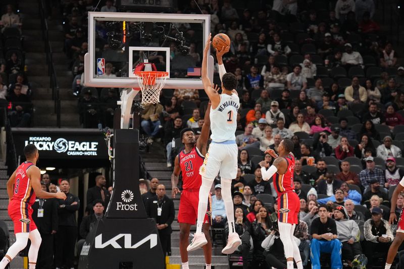 SAN ANTONIO, TX - DECEMBER 8: Victor Wembanyama #1 of the San Antonio Spurs shoots a three point basket during the game  against the New Orleans Pelicans on December 8, 2024 at the Frost Bank Center in San Antonio, Texas. NOTE TO USER: User expressly acknowledges and agrees that, by downloading and or using this photograph, user is consenting to the terms and conditions of the Getty Images License Agreement. Mandatory Copyright Notice: Copyright 2024 NBAE (Photos by Jesse D. Garrabrant/NBAE via Getty Images)