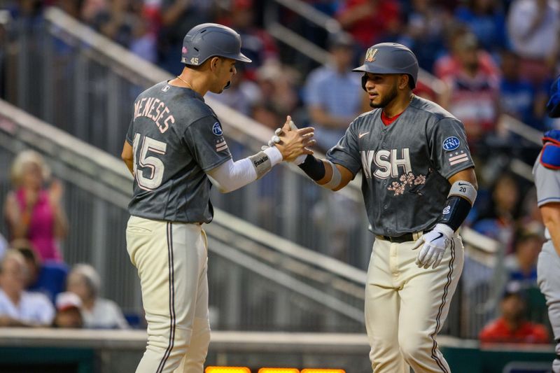 Sep 8, 2023; Washington, District of Columbia, USA; Washington Nationals catcher Keibert Ruiz (20) celebrates with designated hitter Joey Meneses (45) after hitting a three run home run during the first inning against the Los Angeles Dodgers at Nationals Park. Mandatory Credit: Reggie Hildred-USA TODAY Sports