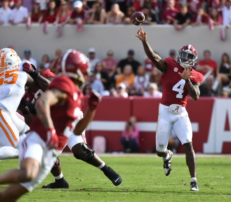 Oct 21, 2023; Tuscaloosa, Alabama, USA;  Alabama Crimson Tide quarterback Jalen Milroe (4) throws a pass to wide receiver Jermaine Burton (3) against Tennessee at Bryant-Denny Stadium. Mandatory Credit: Gary Cosby Jr.-USA TODAY Sports