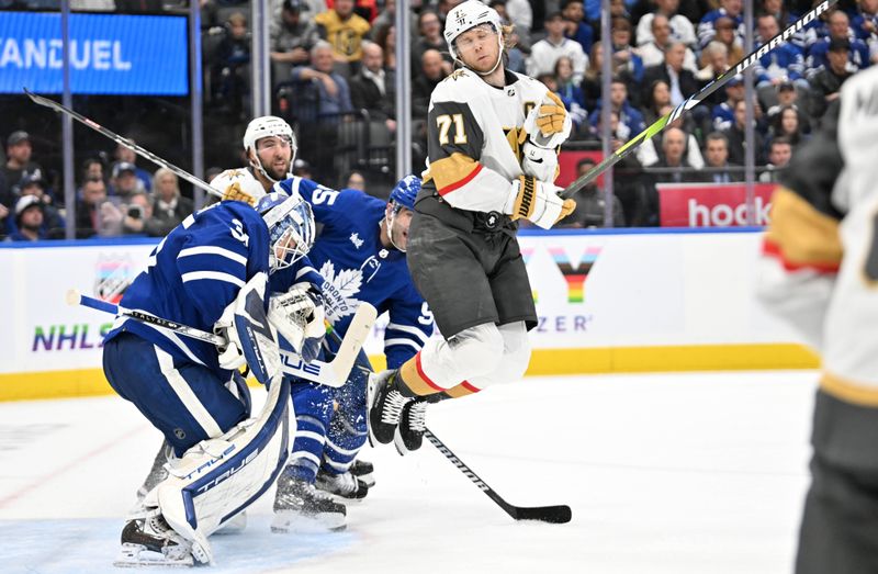 Feb 27, 2024; Toronto, Ontario, CAN;   Vegas Golden Knights forward William Karlsson (71) is hit by the puck as he tries to jump out of the way in front of Toronto Maple Leafs goalie Ilya Samsonov (35) in the second period at Scotiabank Arena. Mandatory Credit: Dan Hamilton-USA TODAY Sports