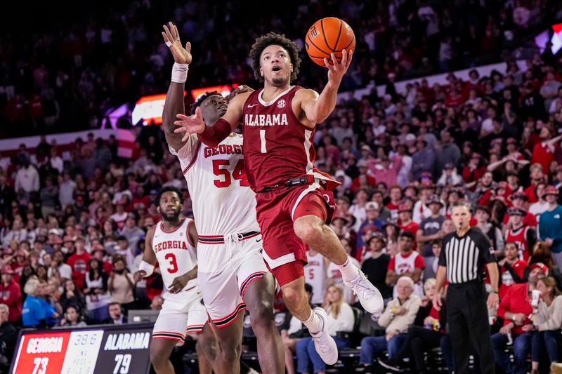 Jan 31, 2024; Athens, Georgia, USA; Alabama Crimson Tide guard Mark Sears (1) goes to the basket behind Georgia Bulldogs center Russel Tchewa (54) during the second half at Stegeman Coliseum. Mandatory Credit: Dale Zanine-USA TODAY Sports