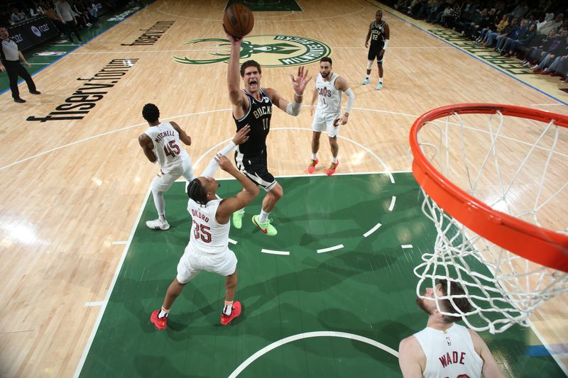 MILWAUKEE, WI - JANUARY 26:  Brook Lopez #11 of the Milwaukee Bucks shoots the ball during the game  against the Cleveland Cavaliers on January 26, 2024 at the Fiserv Forum Center in Milwaukee, Wisconsin. NOTE TO USER: User expressly acknowledges and agrees that, by downloading and or using this Photograph, user is consenting to the terms and conditions of the Getty Images License Agreement. Mandatory Copyright Notice: Copyright 2024 NBAE (Photo by Gary Dineen/NBAE via Getty Images).