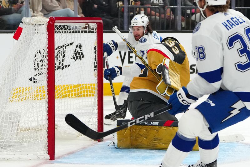 Mar 19, 2024; Las Vegas, Nevada, USA; Tampa Bay Lightning center Anthony Cirelli (71) scores a goal against Vegas Golden Knights goaltender Adin Hill (33) during the first period at T-Mobile Arena. Mandatory Credit: Stephen R. Sylvanie-USA TODAY Sports