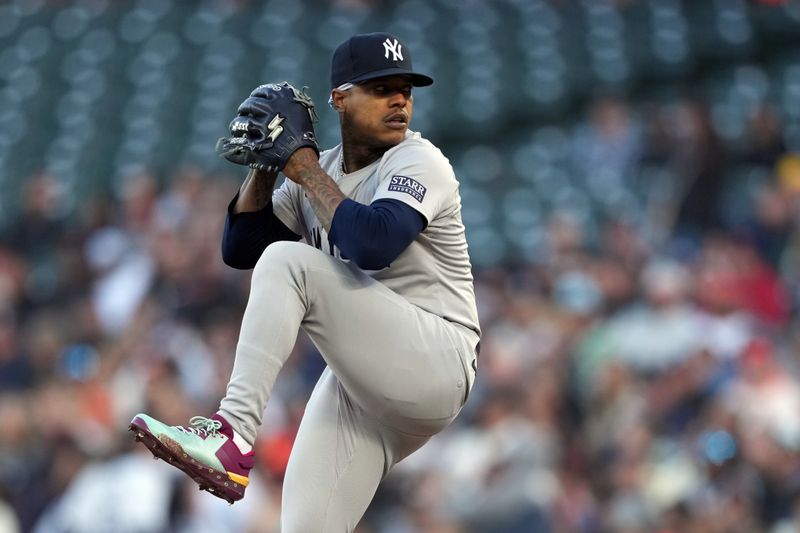 May 31, 2024; San Francisco, California, USA; New York Yankees starting pitcher Marcus Stroman (0) throws a pitch against the San Francisco Giants during the first inning at Oracle Park. Mandatory Credit: Darren Yamashita-USA TODAY Sports