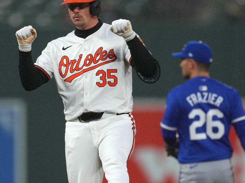 Apr 3, 2024; Baltimore, Maryland, USA; Baltimore Orioles designated hitter Adley Rutschman (35) gestures towards his dugout following his fourth inning double against the Kansas City Royals at Oriole Park at Camden Yards. Mandatory Credit: Mitch Stringer-USA TODAY Sports