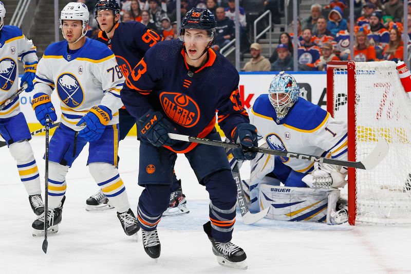 Mar 21, 2024; Edmonton, Alberta, CAN; Edmonton Oilers forward Ryan Nugent-Hopkins (93) looks for a loose puck in front of Buffalo Sabres goaltender Ukko-Pekka Luukkonen (1) during the first period at Rogers Place. Mandatory Credit: Perry Nelson-USA TODAY Sports