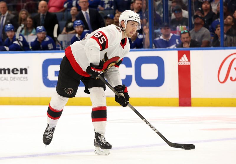 Apr 11, 2024; Tampa, Florida, USA; Ottawa Senators defenseman Jake Sanderson (85) passes the puck against the Tampa Bay Lightning during the second period at Amalie Arena. Mandatory Credit: Kim Klement Neitzel-USA TODAY Sports