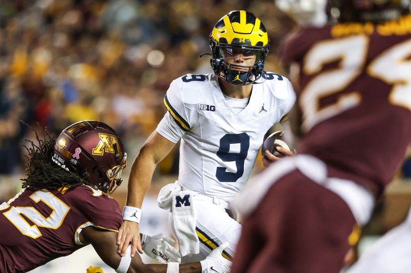 Oct 7, 2023; Minneapolis, Minnesota, USA; Michigan Wolverines quarterback J.J. McCarthy (9) runs the ball against the Minnesota Golden Gophers during the second quarter at Huntington Bank Stadium. Mandatory Credit: Matt Krohn-USA TODAY Sports