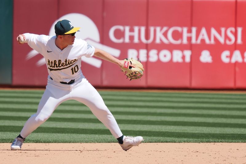 May 1, 2024; Oakland, California, USA; Oakland Athletics third baseman Nick Allen (10) throws the ball to first base for an out against the Pittsburgh Pirates during the ninth inning at Oakland-Alameda County Coliseum. Mandatory Credit: Kelley L Cox-USA TODAY Sports