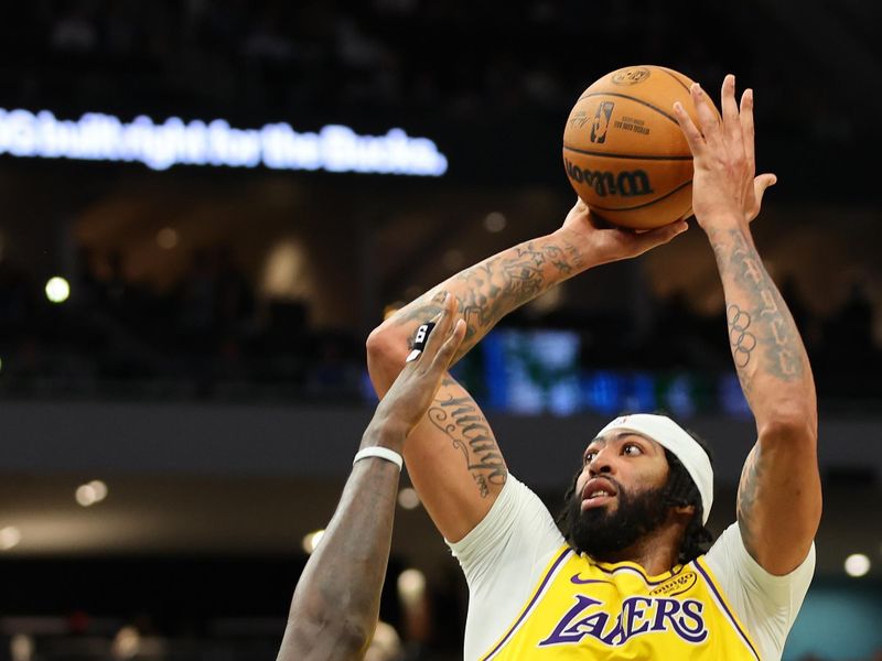 MILWAUKEE, WISCONSIN - OCTOBER 10: Anthony Davis #3 of the Los Angeles Lakers shoots over Bobby Portis #9 of the Milwaukee Bucks during the first half of a preseason game at Fiserv Forum on October 10, 2024 in Milwaukee, Wisconsin.  NOTE TO USER: User expressly acknowledges and agrees that, by downloading and or using this photograph, User is consenting to the terms and conditions of the Getty Images License Agreement. (Photo by Stacy Revere/Getty Images)