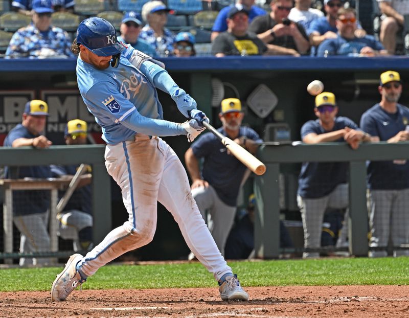 May 8, 2024; Kansas City, Missouri, USA;  Kansas City Royals shortstop Bobby Witt Jr. (7) hits a solo home run in the eighth inning against the Milwaukee Brewers at Kauffman Stadium. Mandatory Credit: Peter Aiken-USA TODAY Sports