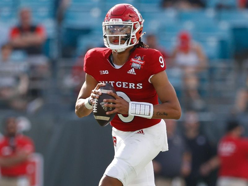 Dec 31, 2021; Jacksonville, Florida, USA;  Rutgers Scarlet Knights quarterback Gavin Wimsatt (9) looks to pass the ball in the second half against the Wake Forest Demon Deacons at TIAA Bank Field. Mandatory Credit: Nathan Ray Seebeck-USA TODAY Sports