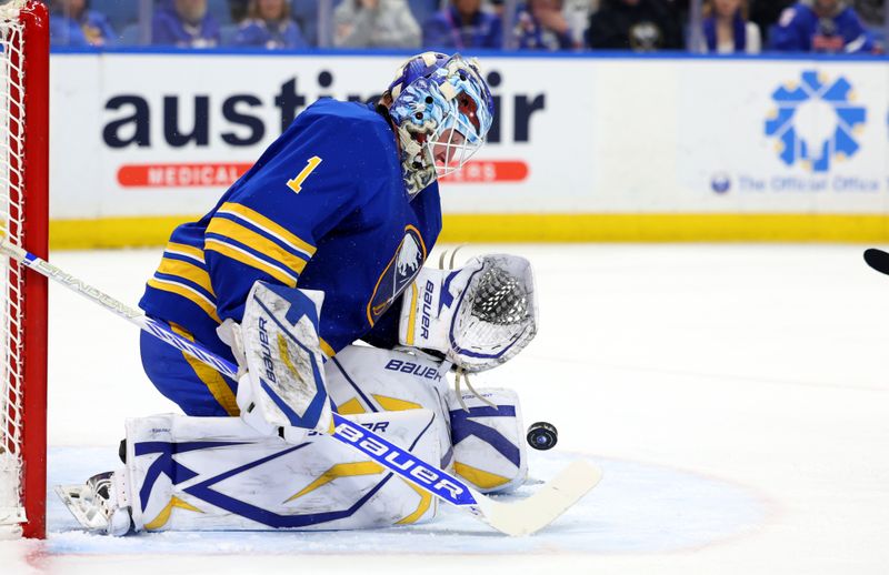 Mar 4, 2025; Buffalo, New York, USA;  Buffalo Sabres goaltender Ukko-Pekka Luukkonen (1) makes a save during the first period against the San Jose Sharks at KeyBank Center. Mandatory Credit: Timothy T. Ludwig-Imagn Images