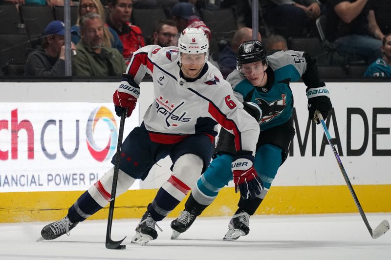 Dec 3, 2025; San Jose, California, USA; Washington Capitals defenseman Jakob Chychrun (6) and San Jose Sharks right wing Collin Graf (51) battle for the puck in the second period at SAP Center at San Jose. Mandatory Credit: David Gonzales-Imagn Images