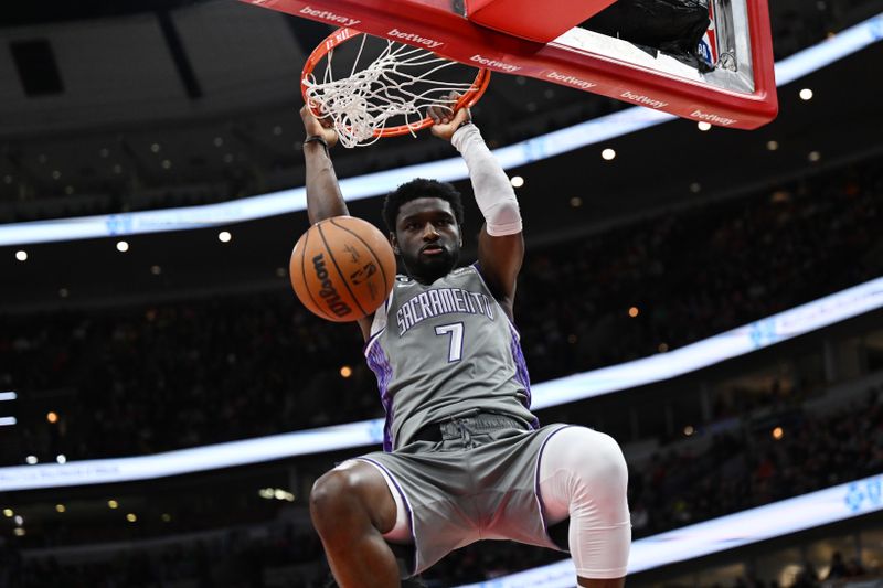 CHICAGO, ILLINOIS - MARCH 15: Chimezie Metu #7 of the Sacramento Kings dunks the ball in the second half of the game against the Chicago Bulls at United Center on March 15, 2023 in Chicago, Illinois.   NOTE TO USER: User expressly acknowledges and agrees that, by downloading and or using this photograph, User is consenting to the terms and conditions of the Getty Images License Agreement.  (Photo by Quinn Harris/Getty Images)