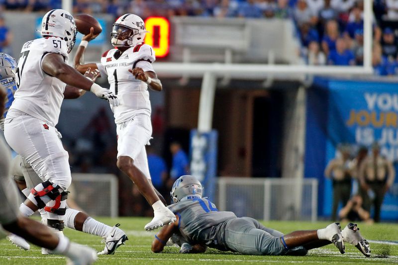 Sep 17, 2022; Memphis, Tennessee, USA; Arkansas State Red Wolves quarterback James Blackman (1) scrambles as Memphis Tigers linebacker Davian Mayo (14) attempts a tackle during the first half at Liberty Bowl Memorial Stadium. Mandatory Credit: Petre Thomas-USA TODAY Sports