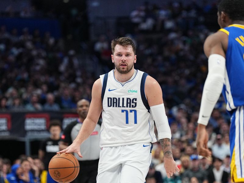 DALLAS, TX - MARCH 13: Luka Doncic #77 of the Dallas Mavericks handles the ball during the game against the Golden State Warriors on March 13, 2024 at the American Airlines Center in Dallas, Texas. NOTE TO USER: User expressly acknowledges and agrees that, by downloading and or using this photograph, User is consenting to the terms and conditions of the Getty Images License Agreement. Mandatory Copyright Notice: Copyright 2024 NBAE (Photo by Glenn James/NBAE via Getty Images)