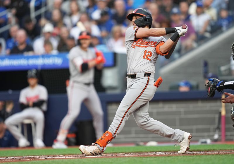 Jun 3, 2024; Toronto, Ontario, CAN; Baltimore Orioles second baseman Connor Norby (12) strikes out making his MLB debut against the Toronto Blue Jays during the second  inning at Rogers Centre. Mandatory Credit: Nick Turchiaro-USA TODAY Sports