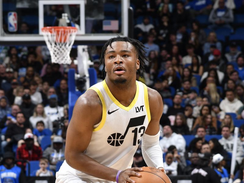 ORLANDO, FL - JANUARY 5 :  Isaiah Collier #13 of the Utah Jazz dribbles the ball during the game against the Orlando Magic on January 5, 2025 at Kia Center in Orlando, Florida. NOTE TO USER: User expressly acknowledges and agrees that, by downloading and or using this photograph, User is consenting to the terms and conditions of the Getty Images License Agreement. Mandatory Copyright Notice: Copyright 2025 NBAE (Photo by Fernando Medina/NBAE via Getty Images)