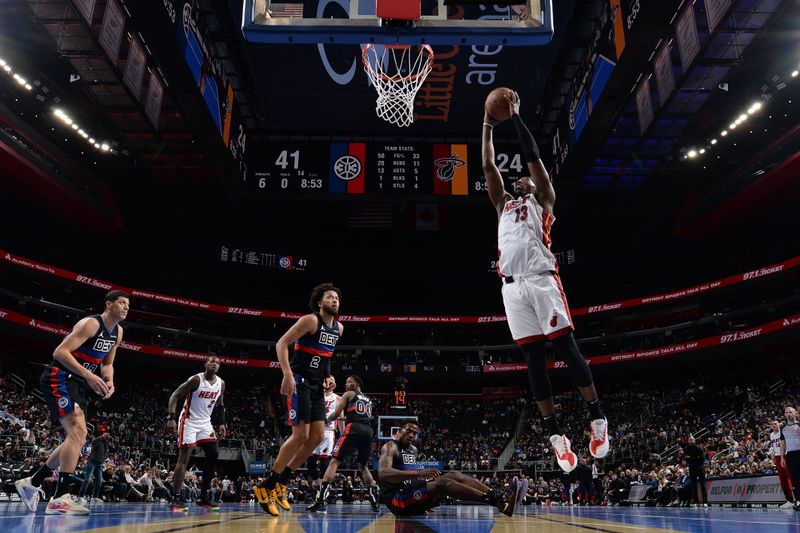 DETROIT, MI - NOVEMBER 12: Bam Adebayo #13 of the Miami Heat grabs the rebound during the game against the Detroit Pistons during the Emirates NBA Cup game on November 12, 2024 at Little Caesars Arena in Detroit, Michigan. NOTE TO USER: User expressly acknowledges and agrees that, by downloading and/or using this photograph, User is consenting to the terms and conditions of the Getty Images License Agreement. Mandatory Copyright Notice: Copyright 2024 NBAE (Photo by Chris Schwegler/NBAE via Getty Images)