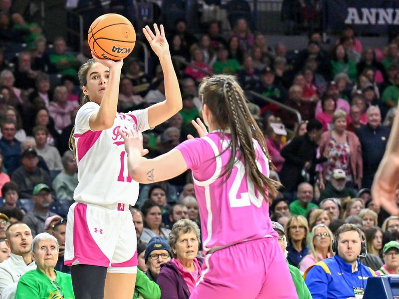 Feb 4, 2024; South Bend, Indiana, USA; Notre Dame Fighting Irish guard Sonia Citron (11) shoots a three point basket over Pittsburgh Panthers guard Aislin Malcolm (20) in the second half at the Purcell Pavilion. Mandatory Credit: Matt Cashore-USA TODAY Sports