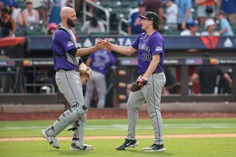 Jul 14, 2024; New York City, New York, USA; Colorado Rockies relief pitcher Victor Vodnik (38) and catcher Jacob Stallings (25) celebrates after defeating the New York Mets at Citi Field. Mandatory Credit: Vincent Carchietta-USA TODAY Sports