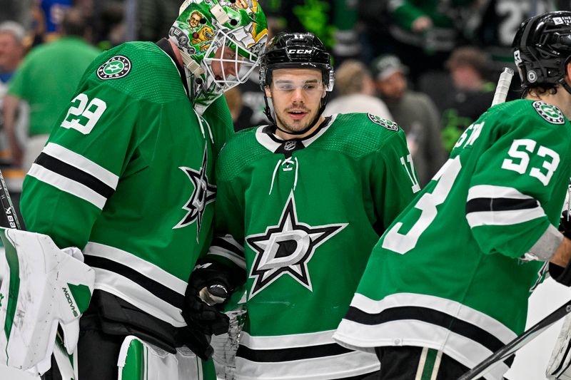 Apr 9, 2024; Dallas, Texas, USA; Dallas Stars goaltender Jake Oettinger (29) and center Logan Stankoven (11) celebrate on the ice after the Stars defeat the Buffalo Sabres at the American Airlines Center. Mandatory Credit: Jerome Miron-USA TODAY Sports