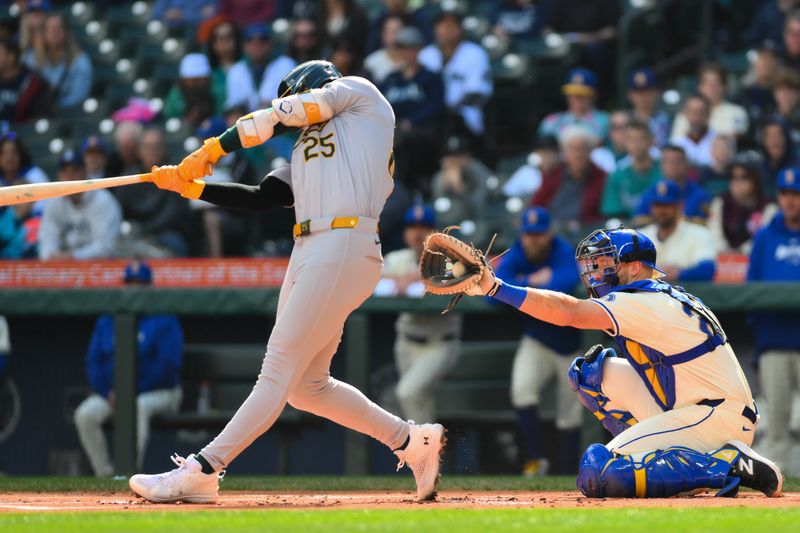 Sep 29, 2024; Seattle, Washington, USA; Seattle Mariners catcher Cal Raleigh (29) catches a strike three pitch intended for Oakland Athletics designated hitter Brent Rooker (25) during the first inning at T-Mobile Park. Mandatory Credit: Steven Bisig-Imagn Images