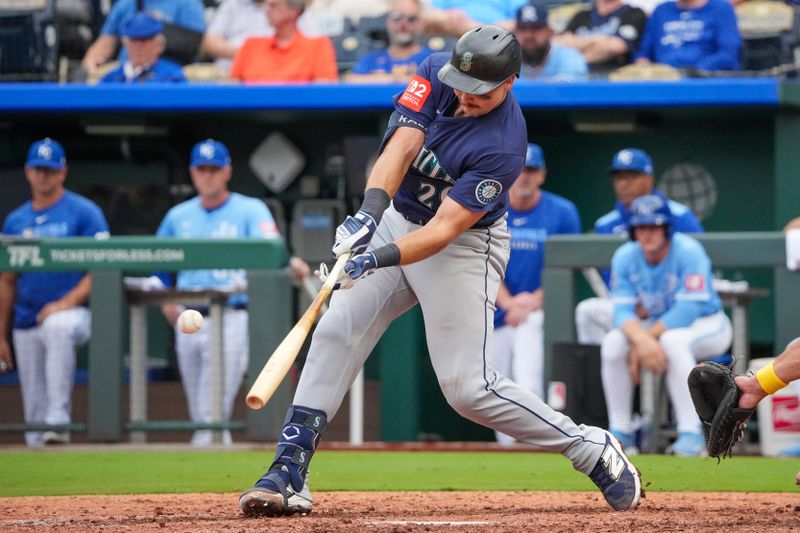 Sep 18, 2025; Kansas City, Missouri, USA; Seattle Mariners catcher Cal Raleigh (29) hits a single against the Kansas City Royals during the ninth inning at Kauffman Stadium. Mandatory Credit: Denny Medley-Imagn Images