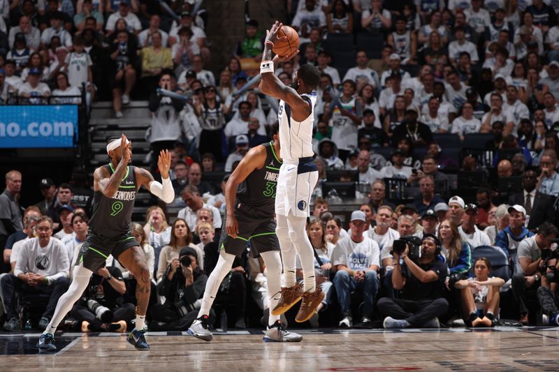 MINNEAPOLIS, MN - MAY 30: Kyrie Irving #11 of the Dallas Mavericks shoots the ball during the game against the Minnesota Timberwolves during Round 3 Game 5 of the 2024 NBA Playoffs on May 30, 2024 at Target Center in Minneapolis, Minnesota. NOTE TO USER: User expressly acknowledges and agrees that, by downloading and or using this Photograph, user is consenting to the terms and conditions of the Getty Images License Agreement. Mandatory Copyright Notice: Copyright 2024 NBAE (Photo by Joe Murphy/NBAE via Getty Images)