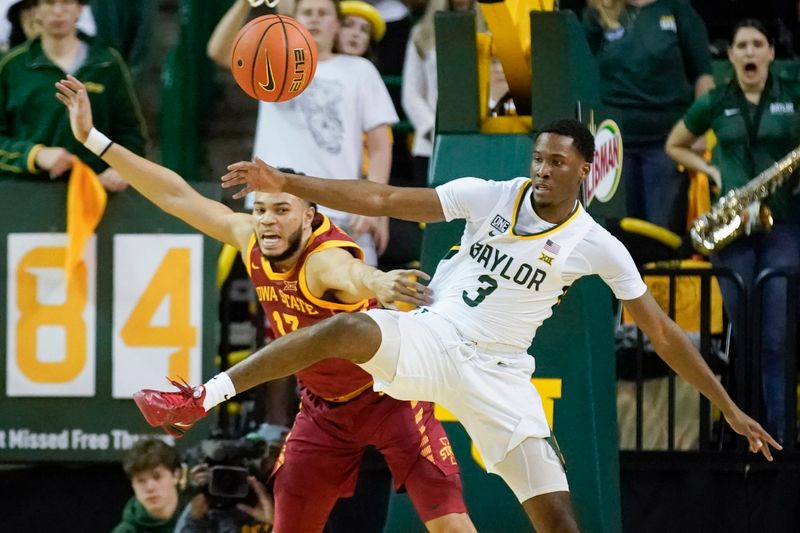 Mar 4, 2023; Waco, Texas, USA; Iowa State Cyclones guard Jaren Holmes (13) and Baylor Bears guard Dale Bonner (3) battle for the loose ball during the second half at Ferrell Center. Mandatory Credit: Raymond Carlin III-USA TODAY Sports