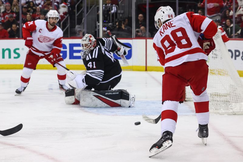 Dec 23, 2023; Newark, New Jersey, USA; Detroit Red Wings right wing Patrick Kane (88) scores a goal on New Jersey Devils goaltender Vitek Vanecek (41) during the first period at Prudential Center. Mandatory Credit: Ed Mulholland-USA TODAY Sports