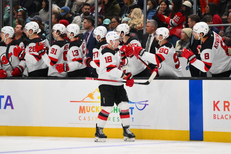 Jan 6, 2025; Seattle, Washington, USA; New Jersey Devils left wing Ondrej Palat (18) celebrates with the bench after scoring a goal against the Seattle Kraken during the third period at Climate Pledge Arena. Mandatory Credit: Steven Bisig-Imagn Images