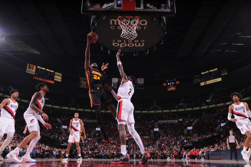 PORTLAND, OR - MARCH 13:  Bruno Fernando #24 of the Atlanta Hawks goes to the basket during the game on March 13, 2024 at the Moda Center Arena in Portland, Oregon. NOTE TO USER: User expressly acknowledges and agrees that, by downloading and or using this photograph, user is consenting to the terms and conditions of the Getty Images License Agreement. Mandatory Copyright Notice: Copyright 2024 NBAE (Photo by Cameron Browne/NBAE via Getty Images)