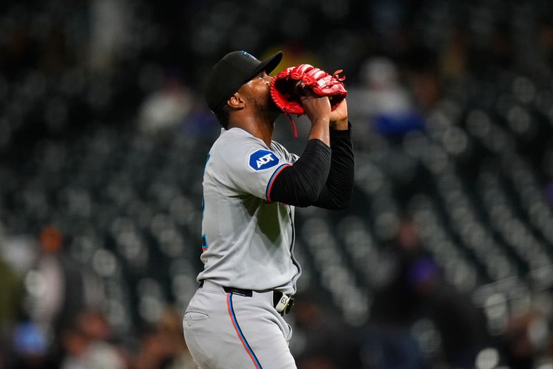 Sep 17, 2025; Denver, Colorado, USA; Miami Marlins relief pitcher George Soriano (62) celebrates the win against the Colorado Rockies at Coors Field. Mandatory Credit: Ron Chenoy-Imagn Images