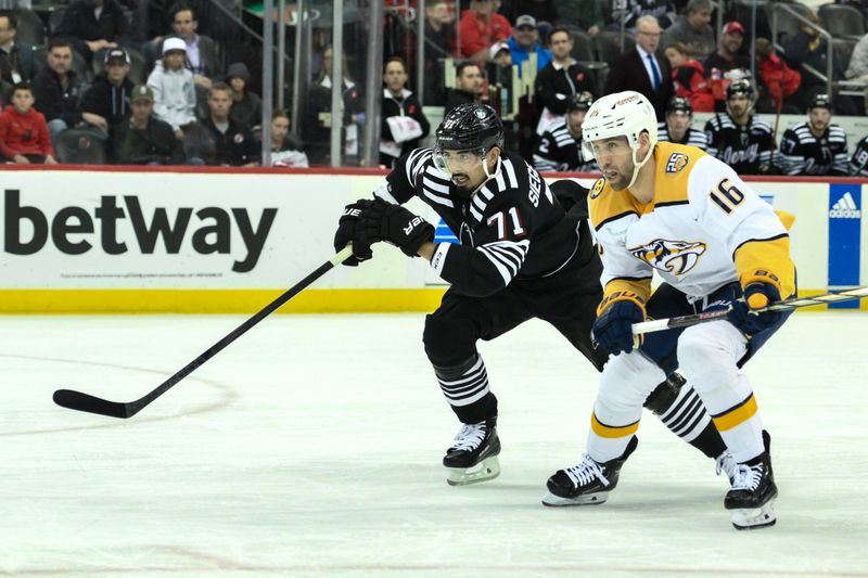 Apr 7, 2024; Newark, New Jersey, USA; New Jersey Devils defenseman Jonas Siegenthaler (71) and Nashville Predators left wing Jason Zucker (16) chase the puck during the first period at Prudential Center. Mandatory Credit: John Jones-USA TODAY Sports