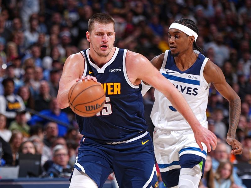 DENVER, CO - APRIL 10: Nikola Jokic #15 of the Denver Nuggets dribbles the ball during the game against the Minnesota Timberwolves on April 10, 2024 at the Ball Arena in Denver, Colorado. NOTE TO USER: User expressly acknowledges and agrees that, by downloading and/or using this Photograph, user is consenting to the terms and conditions of the Getty Images License Agreement. Mandatory Copyright Notice: Copyright 2024 NBAE (Photo by Garrett Ellwood/NBAE via Getty Images)