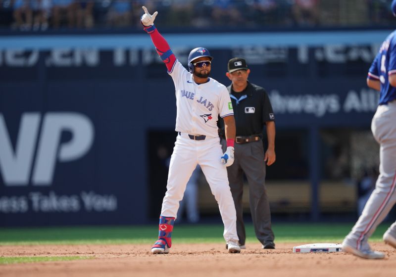 Jul 27, 2024; Toronto, Ontario, CAN; Toronto Blue Jays left fielder Steward Berroa (37) celebrates his first MLB double  of his career against the Texas Rangers during the sixth inning at Rogers Centre. Mandatory Credit: Nick Turchiaro-USA TODAY Sports