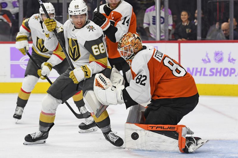 Nov 25, 2024; Philadelphia, Pennsylvania, USA; Philadelphia Flyers goaltender Ivan Fedotov (82) makes a save against Vegas Golden Knights center Callahan Burke (68) during the second period at Wells Fargo Center. Mandatory Credit: Eric Hartline-Imagn Images