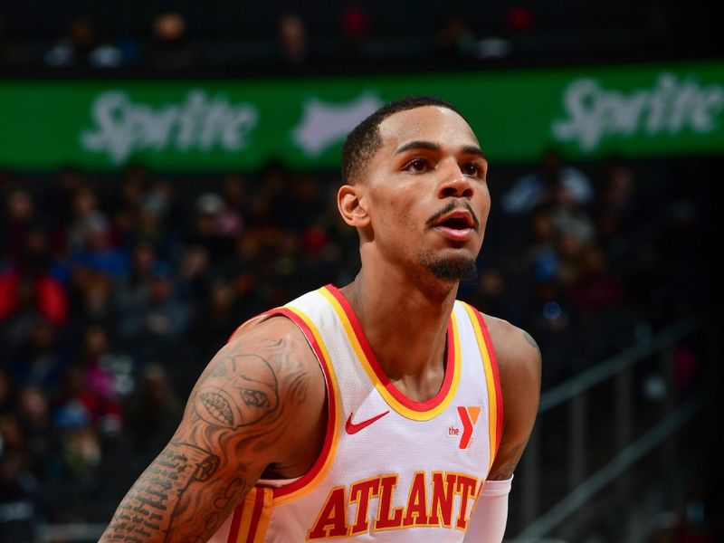 ATLANTA, GA - JANUARY 17: Dejounte Murray #5 of the Atlanta Hawks shoots a free throw during the game on January 17, 2024 at State Farm Arena in Atlanta, Georgia.  NOTE TO USER: User expressly acknowledges and agrees that, by downloading and/or using this Photograph, user is consenting to the terms and conditions of the Getty Images License Agreement. Mandatory Copyright Notice: Copyright 2024 NBAE (Photo by Scott Cunningham/NBAE via Getty Images)