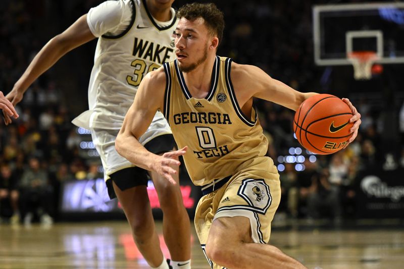 Feb 11, 2023; Winston-Salem, North Carolina, USA; Georgia Tech Yellow Jackets guard Lance Terry (0) drives to the basket against the Wake Forest Demon Deacons during the second half at Lawrence Joel Veterans Memorial Coliseum. Mandatory Credit: William Howard-USA TODAY Sports