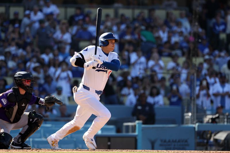 Sep 22, 2024; Los Angeles, California, USA;  Los Angeles Dodgers designated hitter Shohei Ohtani (17) hits a single during the seventh inning against the Colorado Rockies at Dodger Stadium. Mandatory Credit: Kiyoshi Mio-Imagn Images