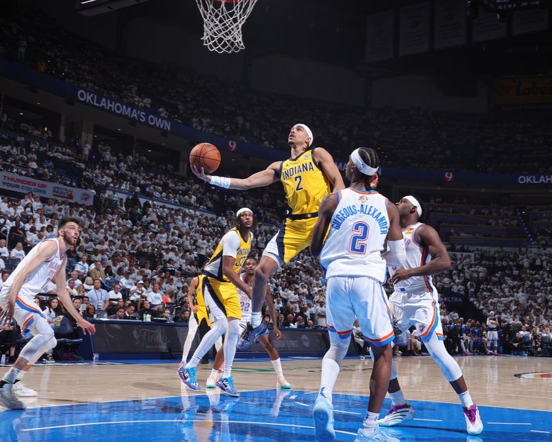 OKLAHOMA CITY, OK - JUNE 5: Andrew Nembhard #2 of the Indiana Pacers drives to the basket during the game against the Oklahoma City Thunder during Game One of the 2025 NBA Finals on June 5, 2025 at Paycom Center in Oklahoma City, Oklahoma. NOTE TO USER: User expressly acknowledges and agrees that, by downloading and or using this photograph, User is consenting to the terms and conditions of the Getty Images License Agreement. Mandatory Copyright Notice: Copyright 2025 NBAE(Photo by Nathaniel S. Butler/NBAE via Getty Images)