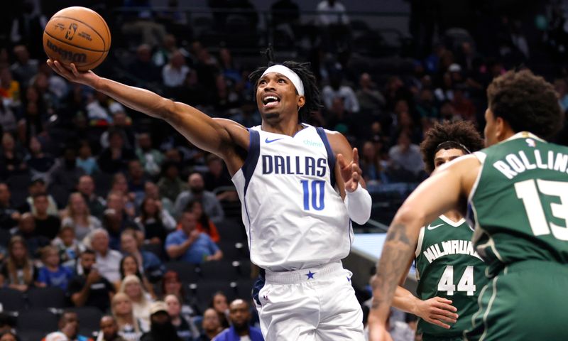 DALLAS, TX -OCTOBER 17 : Brandon Williams #10 of the Dallas Mavericks shoots the ball against the Milwaukee Bucks in the second half of an NBA preseason game at American Airlines Center on October 17, 2024 in Dallas, Texas. NOTE TO USER: User expressly acknowledges and agrees that, by downloading and or using this photograph, User is consenting to the terms and conditions of the Getty Images License Agreement. (Photo by Ron Jenkins/Getty Images)