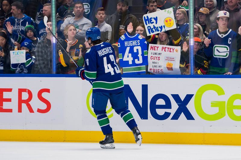 Nov 15, 2023; Vancouver, British Columbia, CAN; Vancouver fans cheer on Canucks defenseman Quinn Hughes (43) during warm up prior to a game against the New York Islanders at Rogers Arena. Mandatory Credit: Bob Frid-USA TODAY Sports