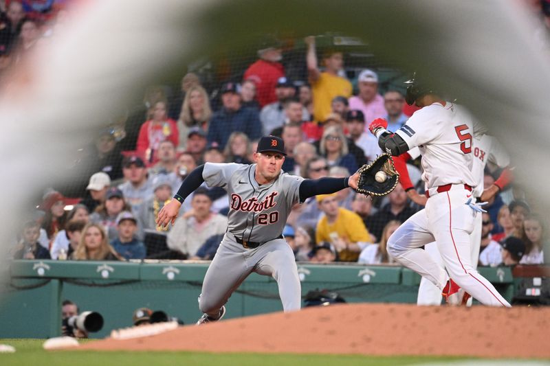 May 30, 2024; Boston, Massachusetts, USA; Detroit Tigers first baseman Spencer Torkelson (20) makes a catch  against Boston Red Sox second baseman Vaughn Grissom (5) during the third inning at Fenway Park. Mandatory Credit: Eric Canha-USA TODAY Sports