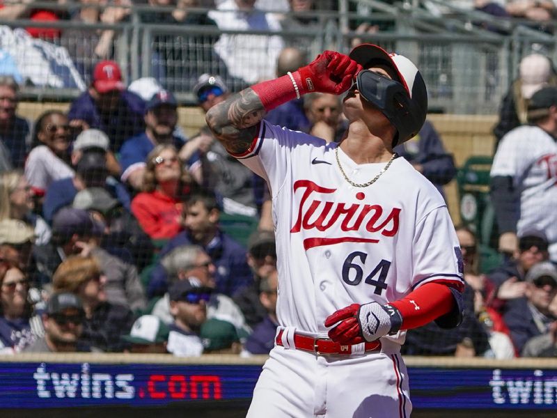 Apr 26, 2023; Minneapolis, Minnesota, USA; Minnesota Twins designated hitter Jose Miranda (64) celebrates his two-run home run against the New York Yankees as he crosses home plate during the fourth inning at Target Field. Mandatory Credit: Nick Wosika-USA TODAY Sports


